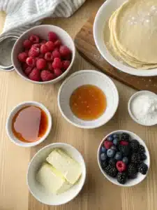 Make fluffy Krusteaz pancakes in minutes with just water, butter, and a touch of vanilla, served warm with maple syrup and fresh berries.