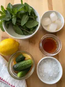 This pickle lemonade drink blends dill pickle brine and lemon juice, served ice-cold for a bold, tangy refreshment with a hint of sweetness.