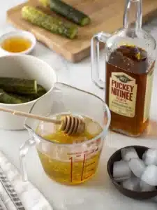 This pickle lemonade drink blends dill pickle brine and lemon juice, served ice-cold for a bold, tangy refreshment with a hint of sweetness.