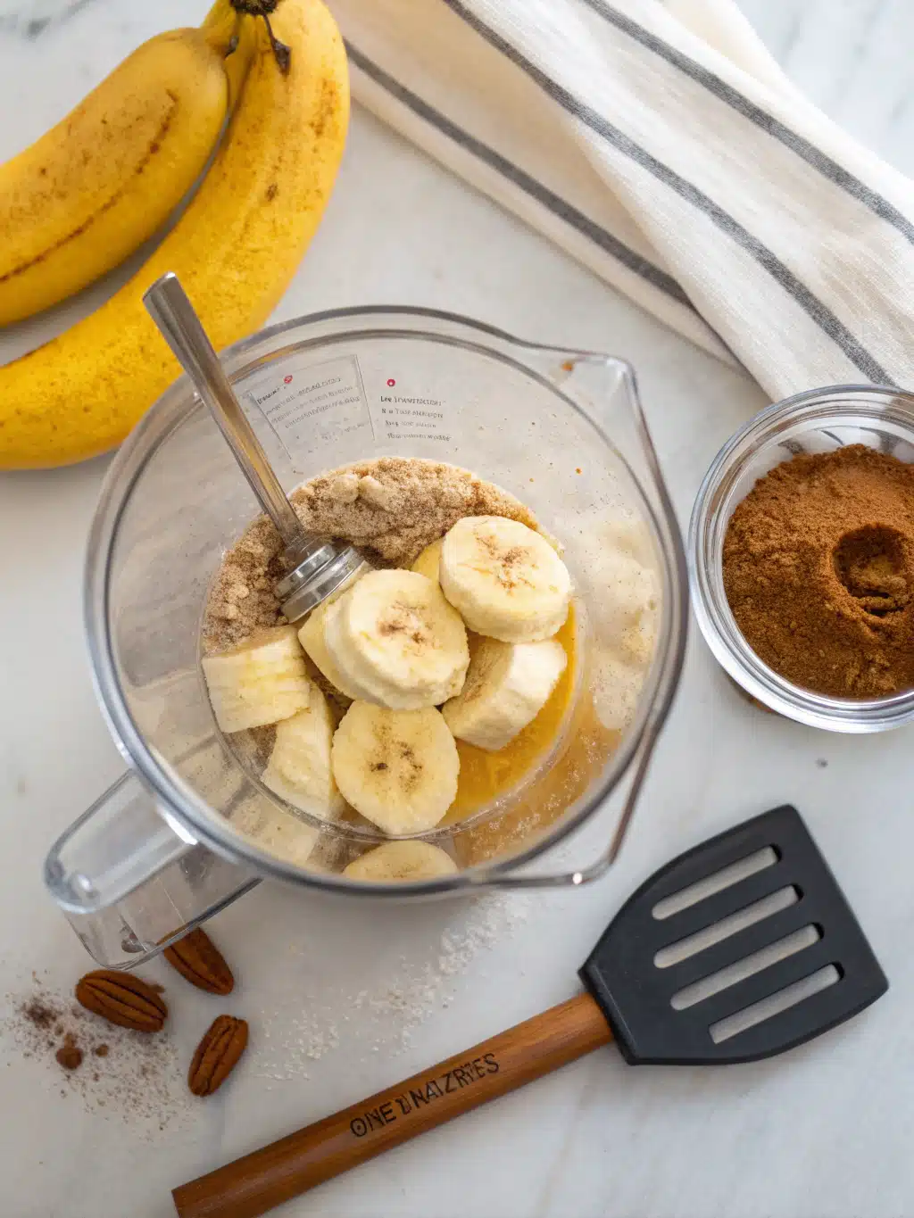 Scraping down the sides of a blender for a smooth protein shake