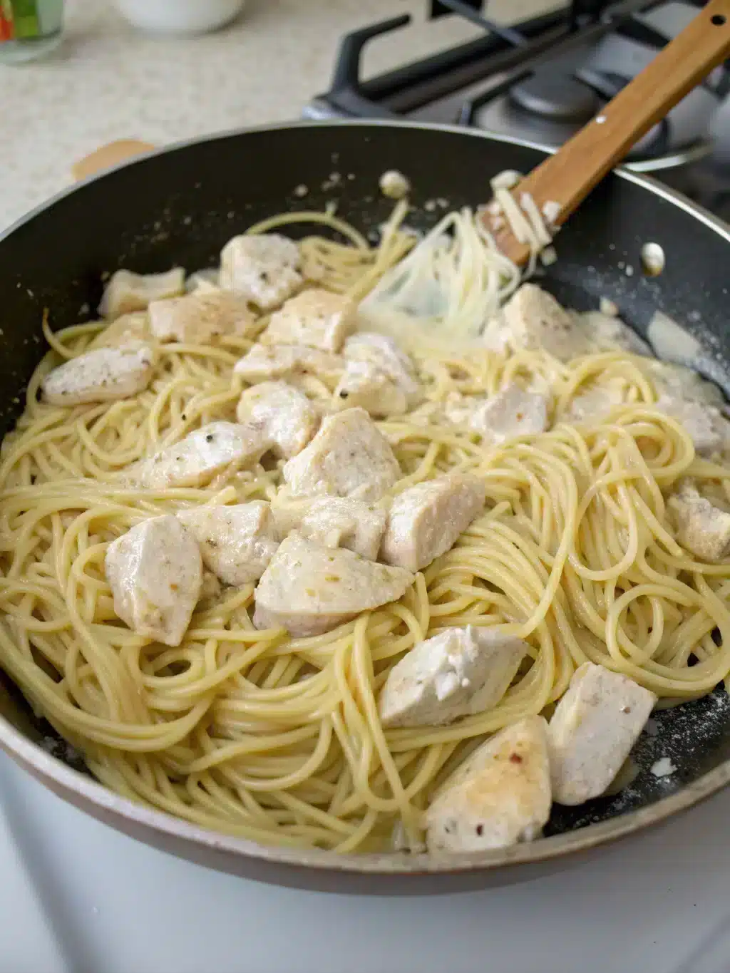 Combining chicken and noodles in skillet
