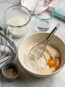 Make fluffy Krusteaz pancakes in minutes with just water, butter, and a touch of vanilla, served warm with maple syrup and fresh berries.