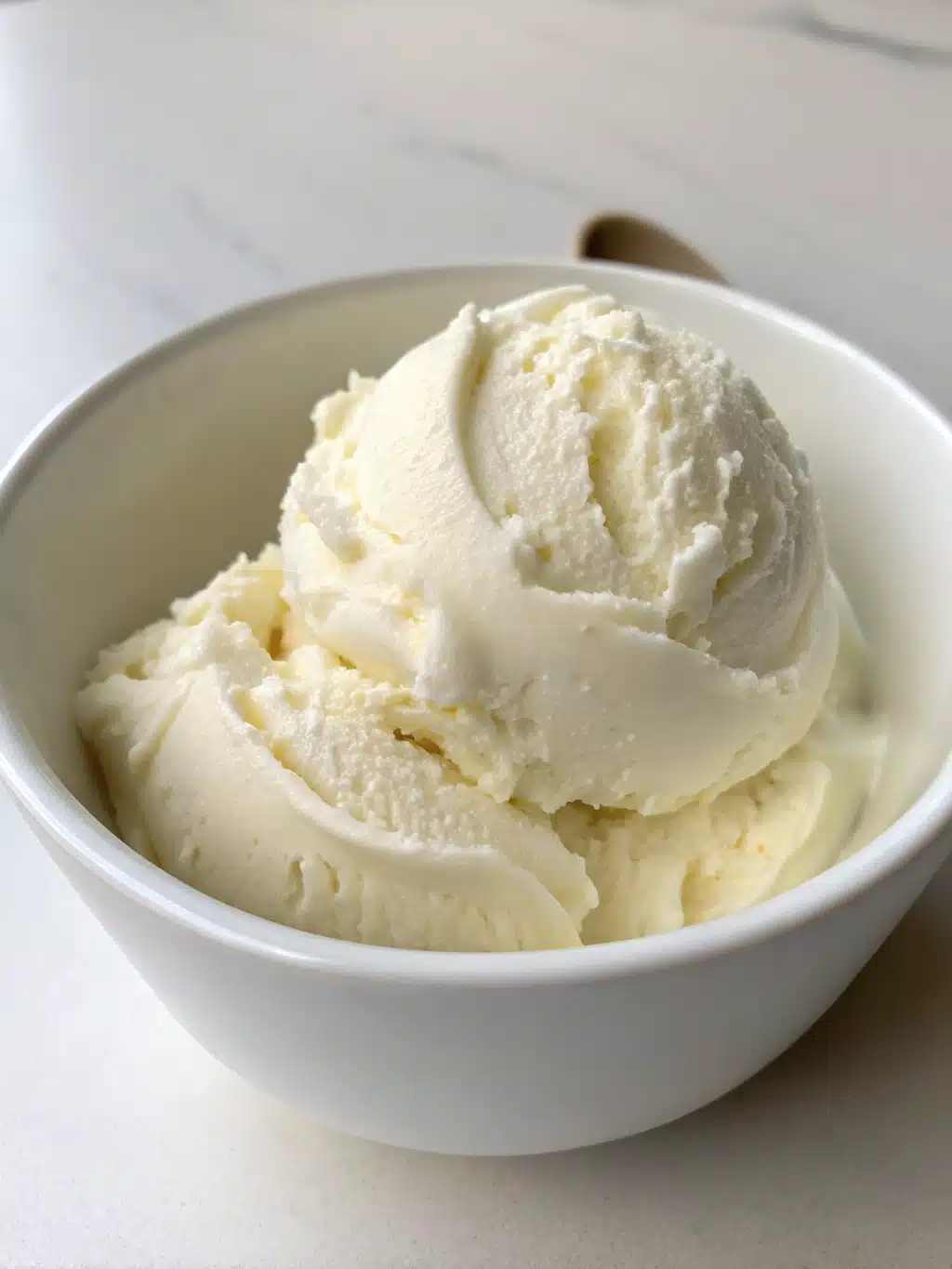 Beautifully served frozen yogurt parfait with layers of fruit and granola