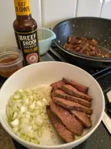 Savor tender flank steak in smoky BBQ sauce tossed with penne pasta for a hearty, flavorful bbq steak pasta dish perfect for weeknight dinners.