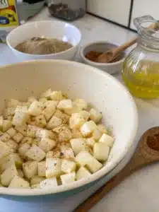Try this easy cooked jicama recipe with roasted cumin-spiced cubes, drizzled with lime juice and topped with fresh cilantro. Perfect warm side dish!