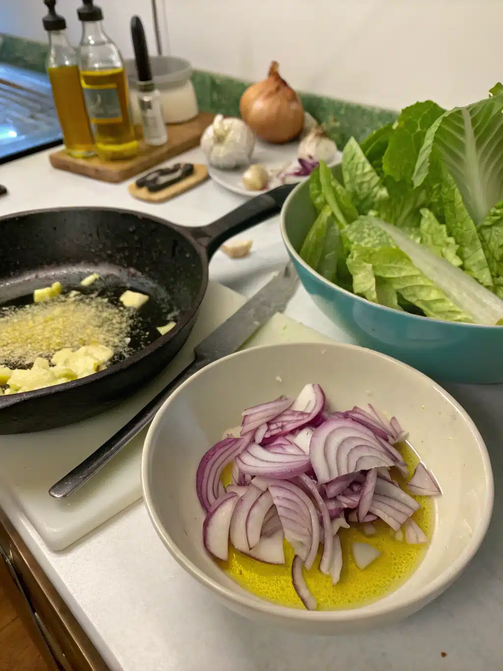 Simmering dressing with onions and garlic for wilted lettuce salad