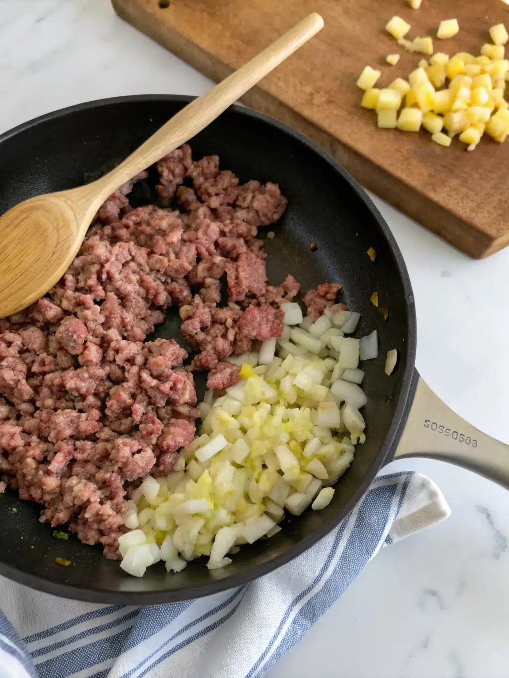 Browning ground beef and onions for cowboy casserole recipe