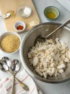 Crab bombs recipe features tender lump crabmeat mixed with panko and Old Bay, pan-fried to golden perfection and served with fresh lemon wedges.