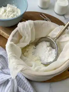 Learn how to make creamy labneh balls with za'atar and olive oil, served chilled with pita or fresh veggies for a refreshing appetizer.