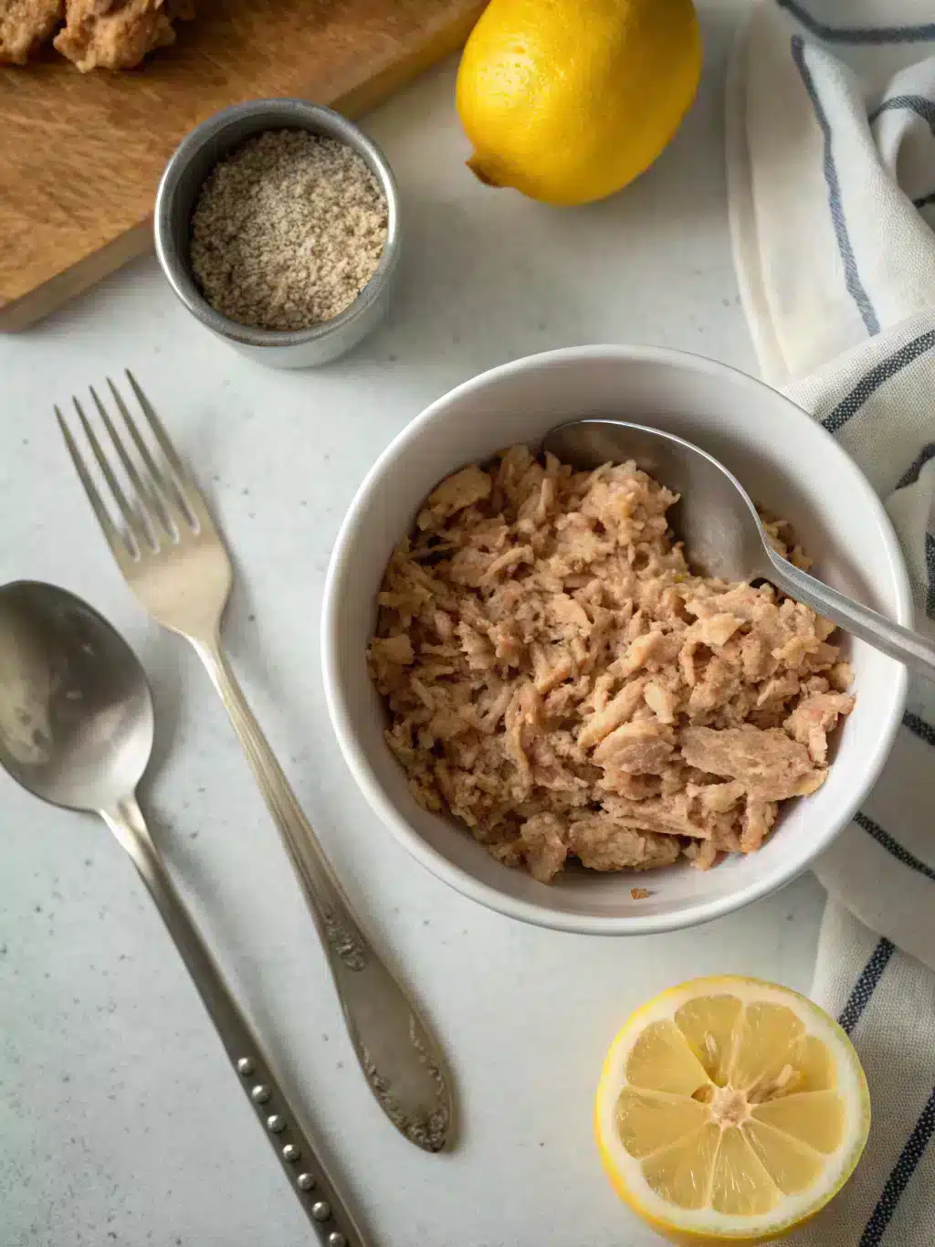 Mixing tuna salad ingredients in a bowl for lettuce wraps