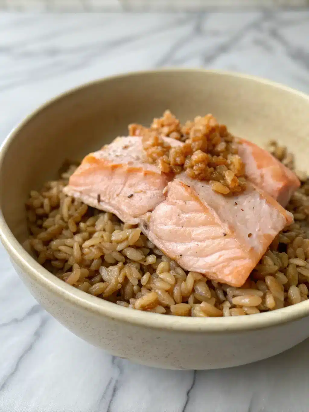 Serving salmon farro bowl with lemon wedges and fresh herbs on a rustic table