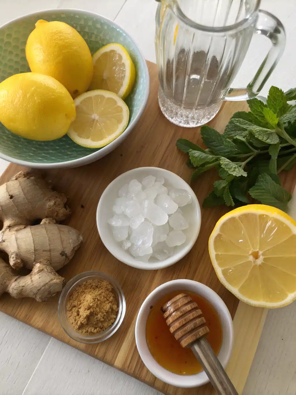 Fresh ingredients for homemade lemon ginger tonic on a wooden table