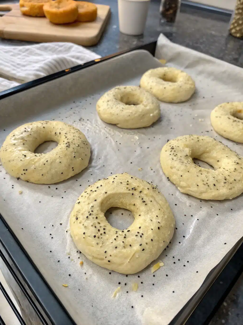 Freshly cooked air fryer bagels with crispy crust on a cooling rack