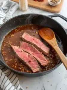 Savor tender flank steak in smoky BBQ sauce tossed with penne pasta for a hearty, flavorful bbq steak pasta dish perfect for weeknight dinners.