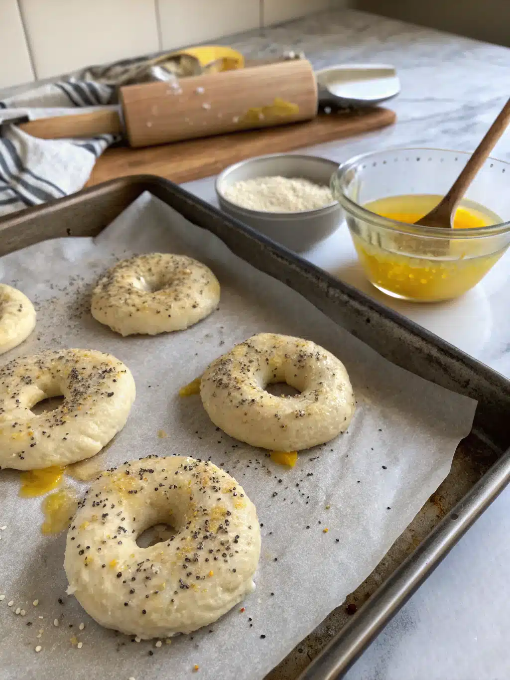 Freshly baked gluten free bagels cooling on a wire rack