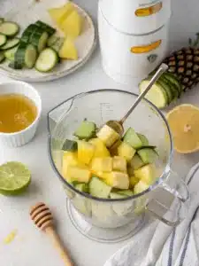 Refreshing pineapple cucumber juice recipe made with ripe pineapple, crisp cucumber, and lime, served over ice for a cool, hydrating drink.