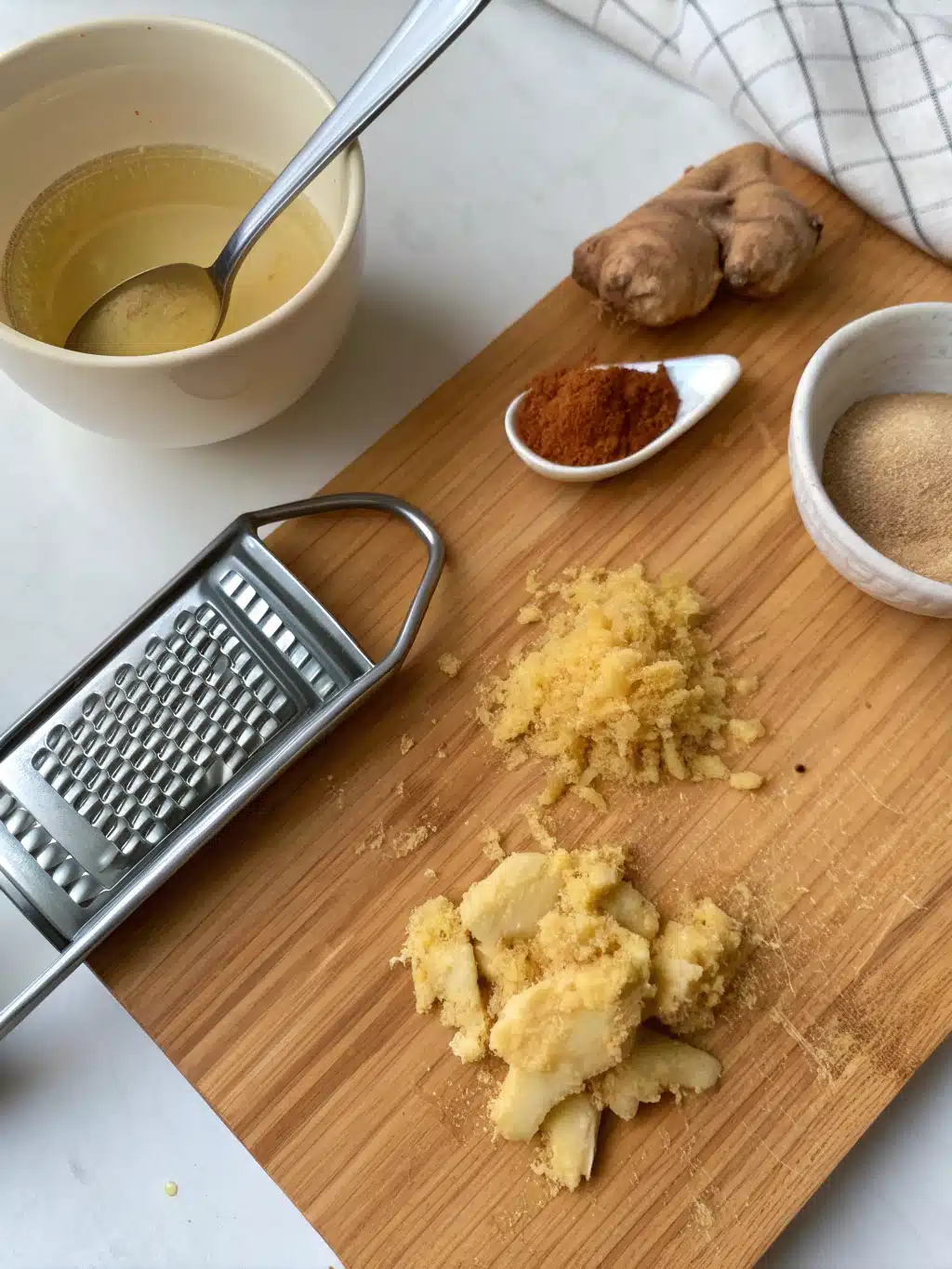 Mixing ginger and cinnamon in warm water for Natural Zepbound Recipe