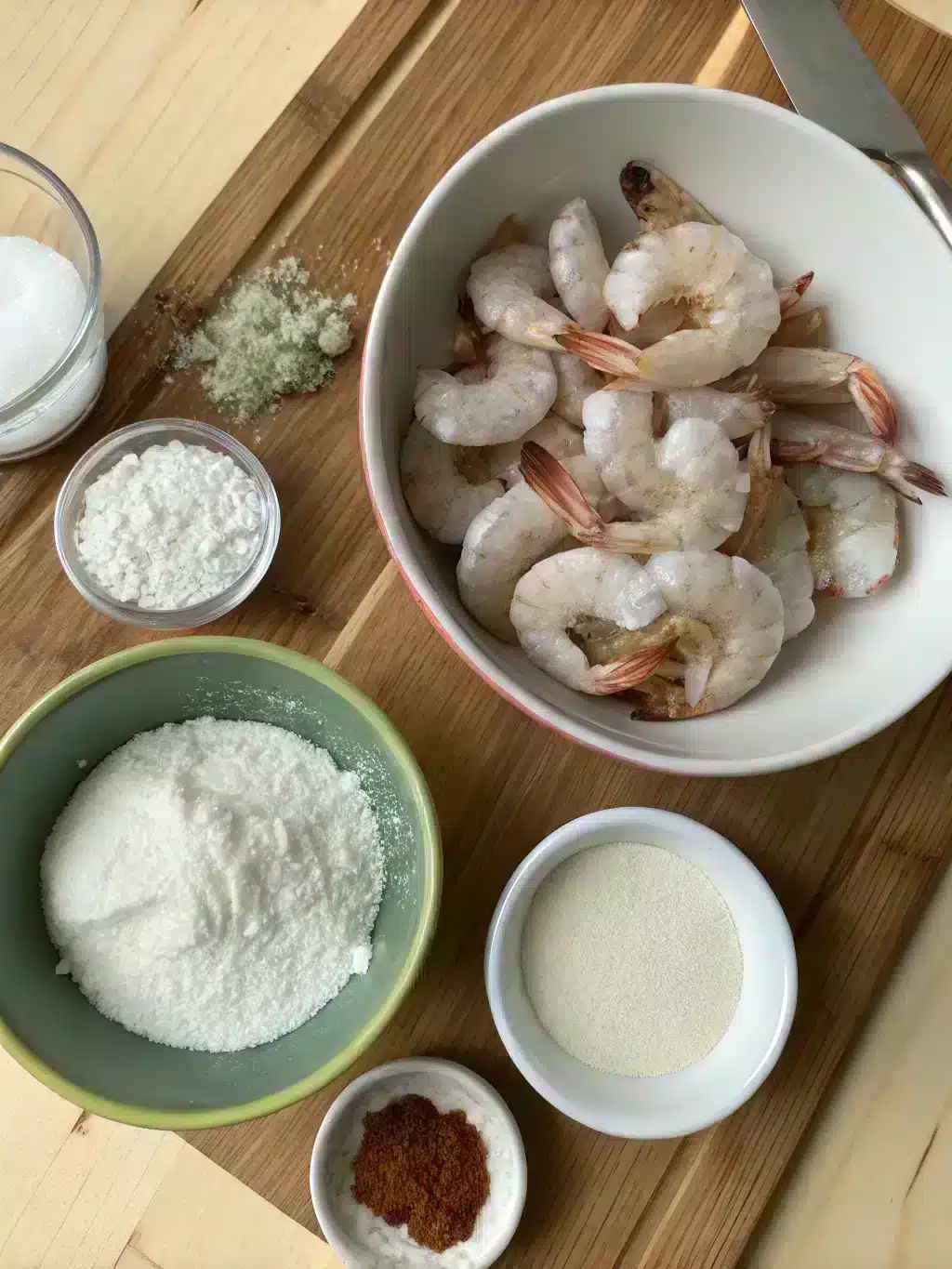 Fresh ingredients for bang bang shrimp including shrimp, buttermilk, and spices