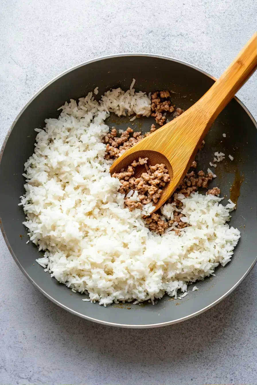 Finished Ground Beef Rice Bowl garnished with green onions