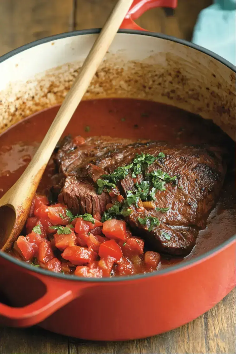 Finished Ropa Vieja plated with cilantro garnish