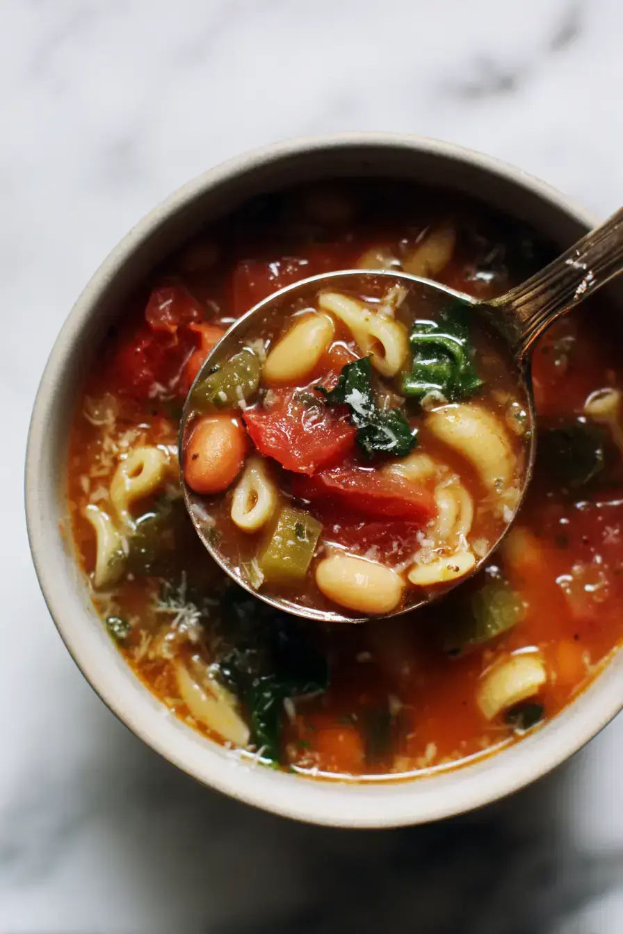 Beautifully served Minestrone Soup in a rustic bowl with Parmesan garnish