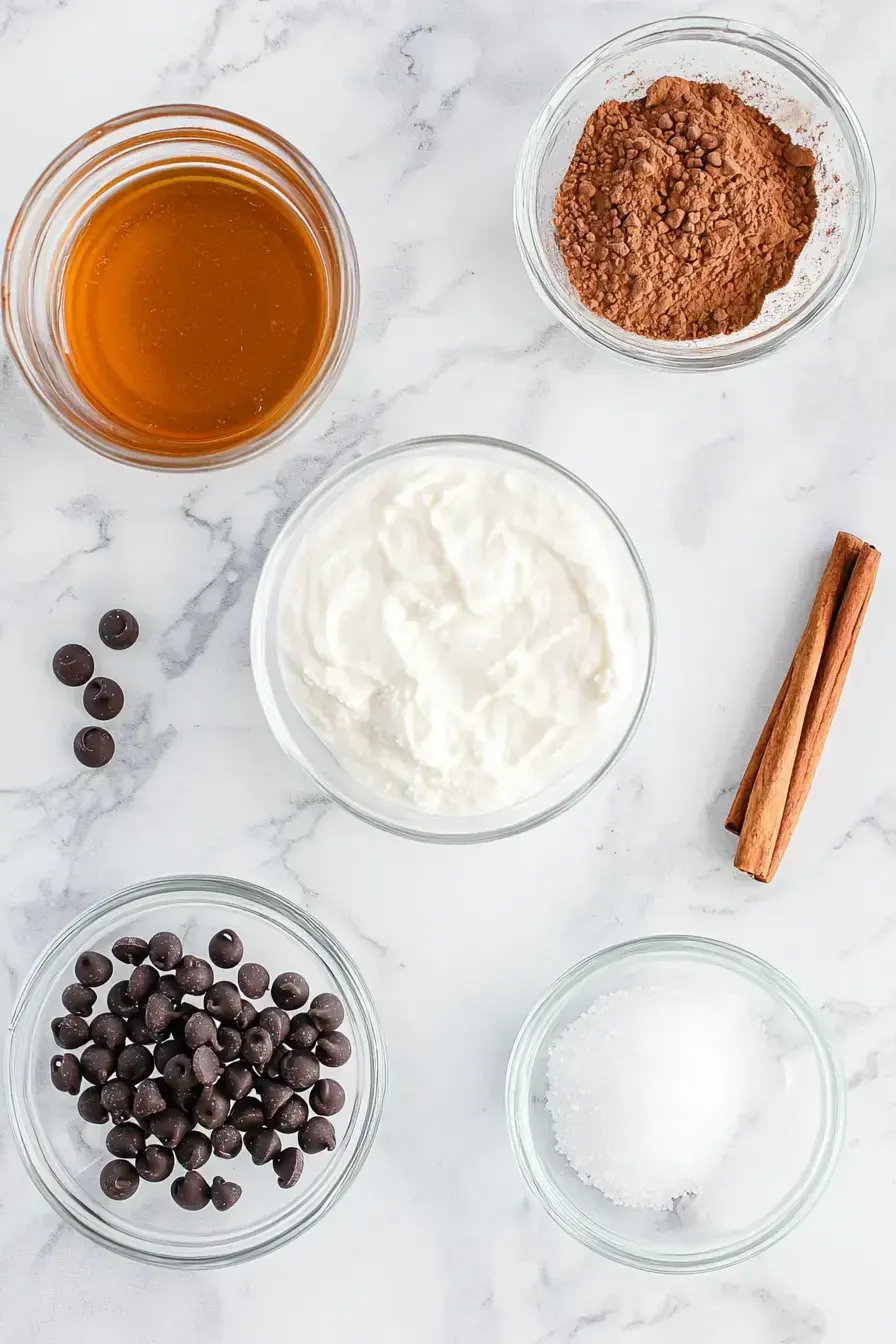 Ingredients for making creamy ricotta chocolate chip filling on a counter