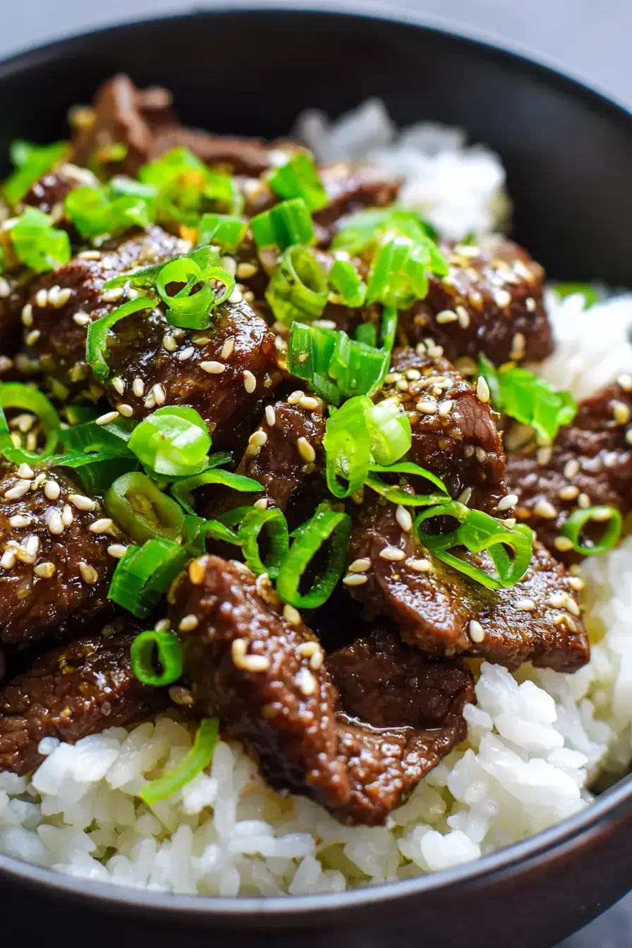 Beautifully plated Steak Rice Bowl with vibrant garnishes and perfect sear